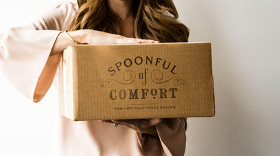 Woman holding a spoonful box