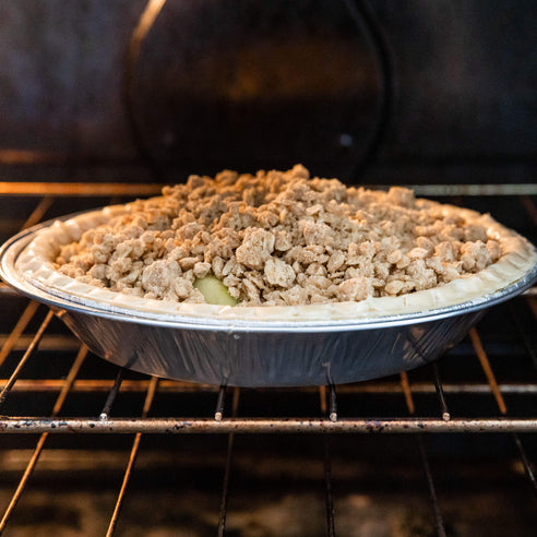 An apple streusel pie being baked